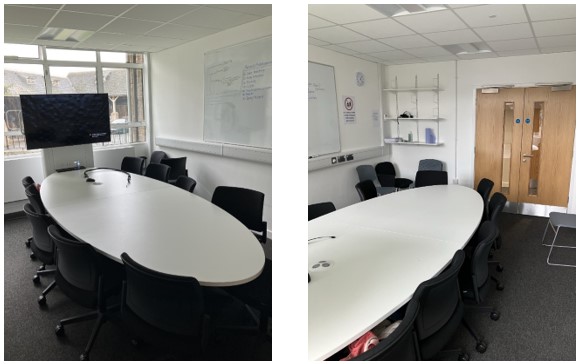 Collaboration Table with Chairs in center of room.